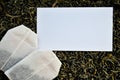 White mockup and tea bags on a loose leaf tea background Royalty Free Stock Photo