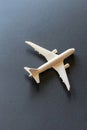 A white model airplane is sitting on a black surface Royalty Free Stock Photo