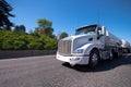 Semi truck with two tank trailers carry fuel on the road Royalty Free Stock Photo