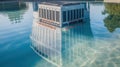 Modern Building and Its Reflection in a Clear Pool of Water Royalty Free Stock Photo