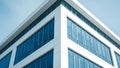 White modern building corner with blue glass windows against sky architecture Royalty Free Stock Photo
