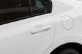 White modern car details - fuel tank cap ( closed petrol cover ) and door handle Royalty Free Stock Photo