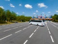 White Modern comfortable tourist bus driving through highway to Disneyland. Royalty Free Stock Photo