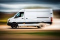 White modern delivery small shipment cargo courier van moving fast on motorway road. Mini bus driving. Blurred image Royalty Free Stock Photo