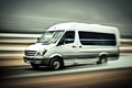 White modern delivery small shipment cargo courier van moving fast on motorway road. Mini bus driving. Blurred image Royalty Free Stock Photo