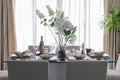 White modern dinning room with flower on table
