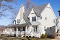 A white modern farmhouse with a covered front porch.