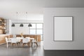 White modern kitchen interior. Dining area with wooden table. Concrete floor. Panoramic window. Mock up poster on wall Royalty Free Stock Photo