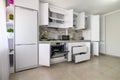 White modern kitchen interior, some drawers pulled out Royalty Free Stock Photo