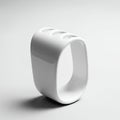 White, modern, rectangular ceramic object with rounded edges stands upright. It Royalty Free Stock Photo
