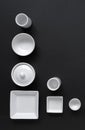 White, modern tableware in various designs on a black background Royalty Free Stock Photo