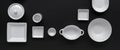 White, modern tableware in various designs on a black background Royalty Free Stock Photo