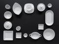 White, modern tableware in various designs on a black background Royalty Free Stock Photo