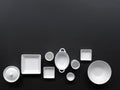 White, modern tableware in various designs on a black background Royalty Free Stock Photo