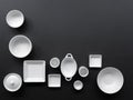 White, modern tableware in various designs on a black background Royalty Free Stock Photo