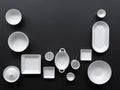 White, modern tableware in various designs on a black background Royalty Free Stock Photo