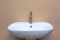 White modern wash basin and silver Faucet. It for wash hands, face and clean. Royalty Free Stock Photo