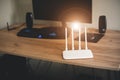 White Modern Wi-Fi router on the table in room. Wireless ethernet connection signal Royalty Free Stock Photo