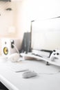 White modern wired gaming mouse in a white comfortable gamer workspace. Close-up of a special device Royalty Free Stock Photo