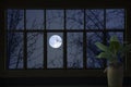 White moon in blue sky in glass window view at night Royalty Free Stock Photo