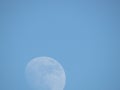 White moon silhouette in the blue sky. Bright blue sky. Royalty Free Stock Photo