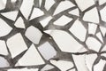 The white mosaics wall from the broken pieces of ceramicporcelain tiles. Royalty Free Stock Photo