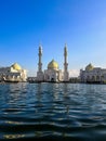 White mosque and blue water surface Royalty Free Stock Photo