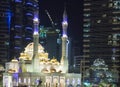 White mosque illuminated with blue lights in Dubai, U.A.E. Royalty Free Stock Photo