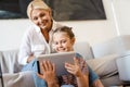White mother and daughter using tablet computer together Royalty Free Stock Photo