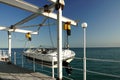 White Motor Boat Hanging On The Pier Davit Royalty Free Stock Photo