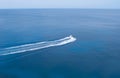 White motor boat with long trail behind Royalty Free Stock Photo