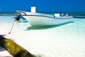 White motor boat on a sand beach in the ocean Royalty Free Stock Photo