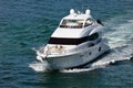 White Mini-Motor Yacht Cruising off Miami Beach Royalty Free Stock Photo