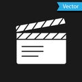 White Movie clapper icon isolated on black background. Film clapper board. Clapperboard sign. Cinema production or media Royalty Free Stock Photo