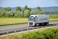 White moving Volvo truck coupled with semi-trailer located on slovak D1 highway. Royalty Free Stock Photo