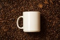 White mug against coffee beans with anise stars lying like steam Royalty Free Stock Photo