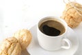 White mug of black coffee, cookies