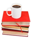 White mug of coffee on stack of books Royalty Free Stock Photo