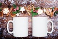 White Mug mockup, blank cup glass with Christmas background. Christmas tree on dark wooden board. Top view