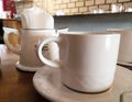 White mug in a table counter Royalty Free Stock Photo