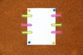 White and multicolored notes on cork board for messages Royalty Free Stock Photo