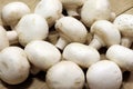 White mushrooms champignon on a wooden table Royalty Free Stock Photo