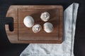 White mushrooms on the wooden board