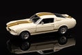 the white mustang is parked on the reflective surface with its doors open Royalty Free Stock Photo