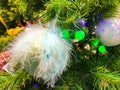 White Nacreous Glass New Year`S Ball And Snow-Covered Branches Of A Christmas Tree Royalty Free Stock Photo