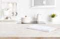 White napkin on table with blurred kitchen cooking zone background Royalty Free Stock Photo
