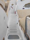 White narrow stairs between white Santorini houses Royalty Free Stock Photo