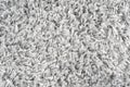 White natural fleece carpet texture background. Wool fabric texture fragment shaggy mat Royalty Free Stock Photo