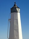 White nautical tower against vivid blue sky