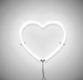 White neon light heart icon on grey background. Ready for greeting card